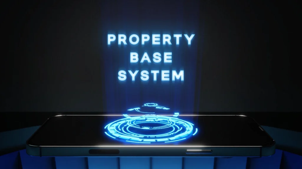 Un téléphone intelligent affiche les mots 'PROPERTY BASE SYSTEM' en bleu clair sur un fond sombre, avec un cercle lumineux bleu en dessous.